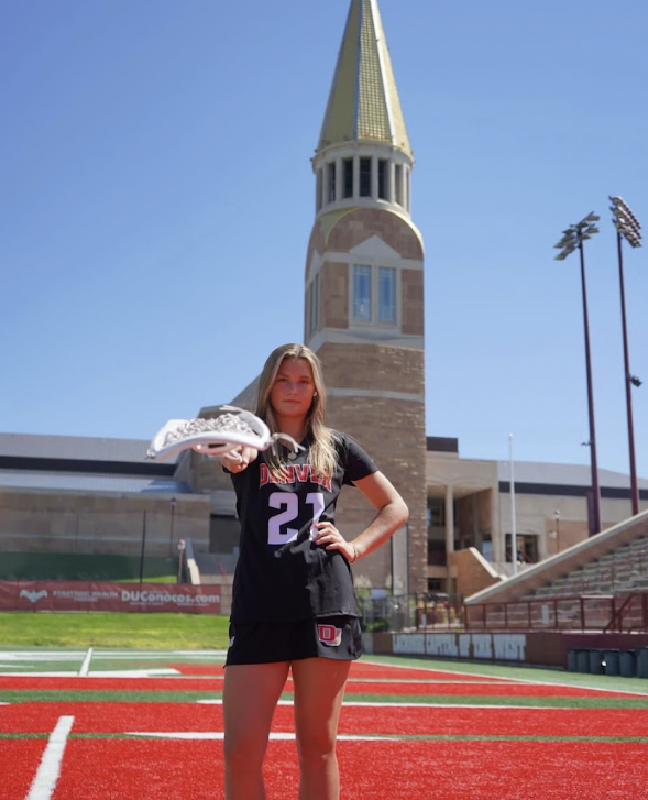 Junior Courtney Whittaker poses on the University of Denver lacrosse field. Whittaker verbally committed to the university’s lacrosse program a few days later. “I am thankful for my family for supporting me through everything,” Whittaker said.  